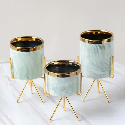 Marble mini planter with gold stand presented on a crisp white marble background  highlighting its compact size and modern style.