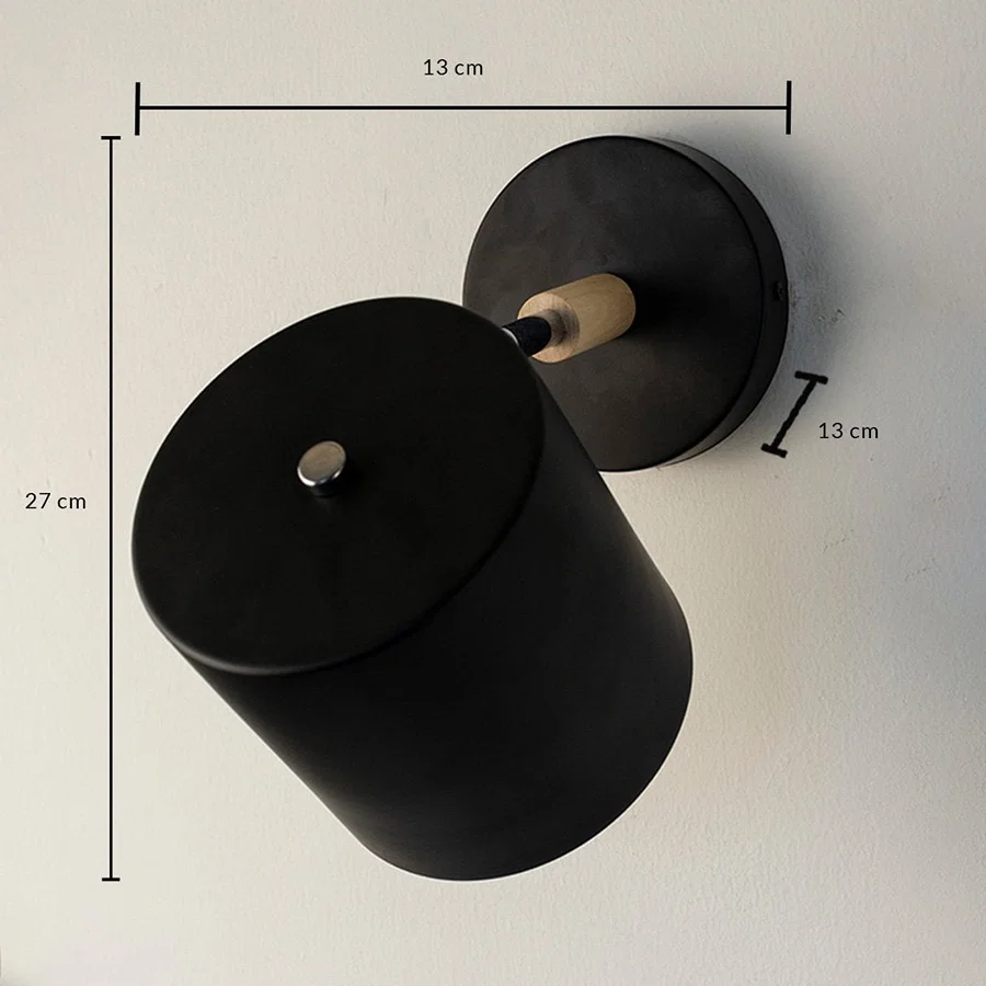 Black metal wall light showing 27 cm height 11 cm width and 7 cm projection dimensions suitable for modern interior wall mounting.vv