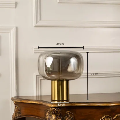 Halo glass table lamp with 31 cm height 29 cm width and 12 cm base golden finish ideal for modern decorative home lighting.