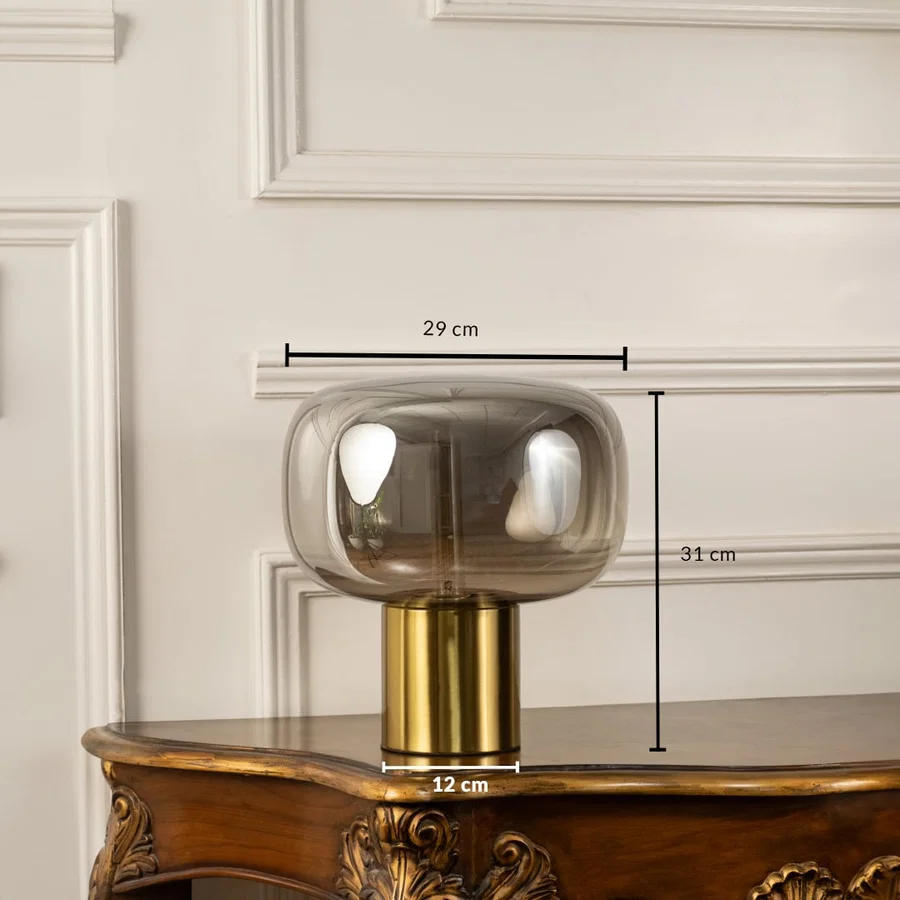 Halo glass table lamp with 31 cm height 29 cm width and 12 cm base golden finish ideal for modern decorative home lighting.