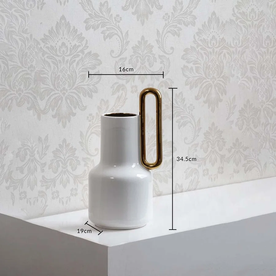 White ceramic vase with gold handle and 34.5 cm height and 19 cm width shown clearly for accurate home decor size reference.