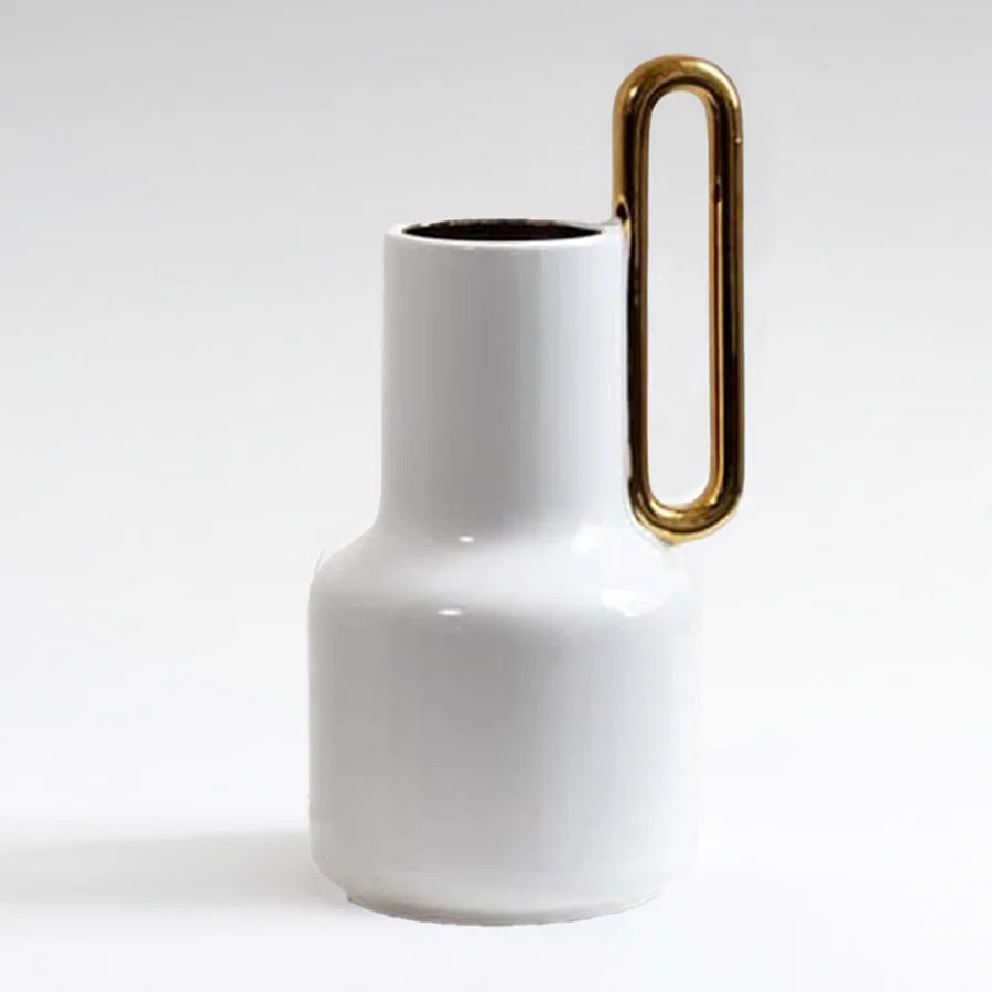 White ceramic vase with gold handle detail for tabletop styling and modern luxury home decor arrangements.