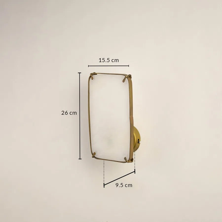 Marble gold wall light with 24 cm height 15.5 cm width and 9.5 cm depth for modern decor spaces.