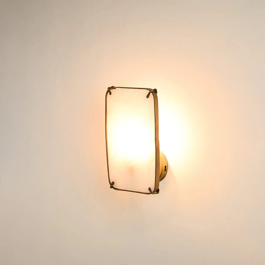 Modern marble wall light with warm ambient glow for stylish bedroom and luxury decor styling spaces.

