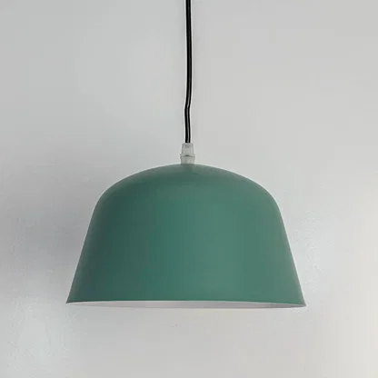 Matte green metal dome pendant light with smooth finish crafted for modern kitchens and dining spaces.
