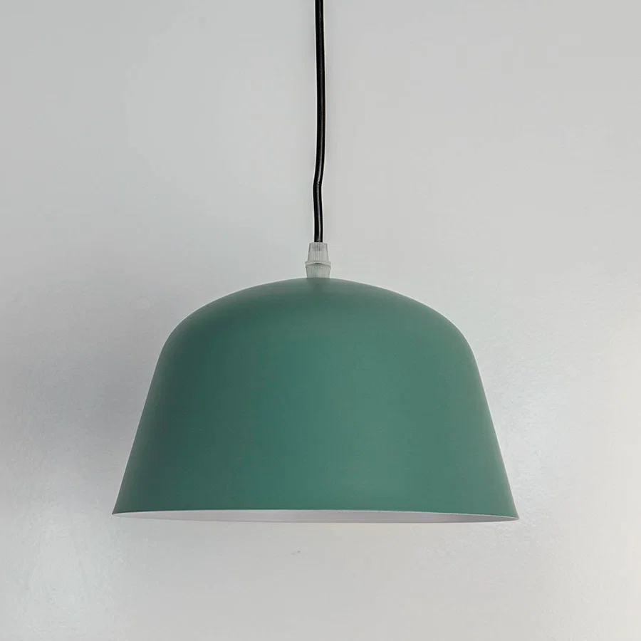 Matte green metal dome pendant light with smooth finish crafted for modern kitchens and dining spaces.
