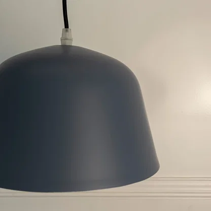 Detailed view of blue metal pendant light with smooth finish highlighting premium craftsmanship.
