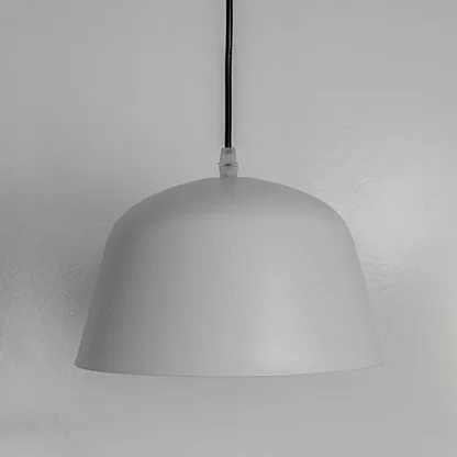 Minimalist white metal pendant light with rounded dome shade crafted for contemporary interiors.