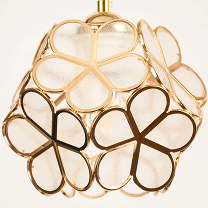 Gold metal geometric pendant light closeup showcasing artistic frame for luxurious modern ceiling lighting decor.