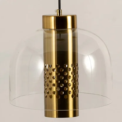 Smoke glass pendant light closeup highlighting perforated gold metal detailing and premium lighting craftsmanship quality.
