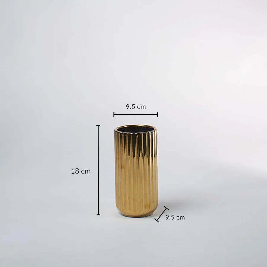 A gold ribbed vase shown with measurements of 18 cm height and 9.5 cm width clearly presenting its compact decorative size in a clean layout.