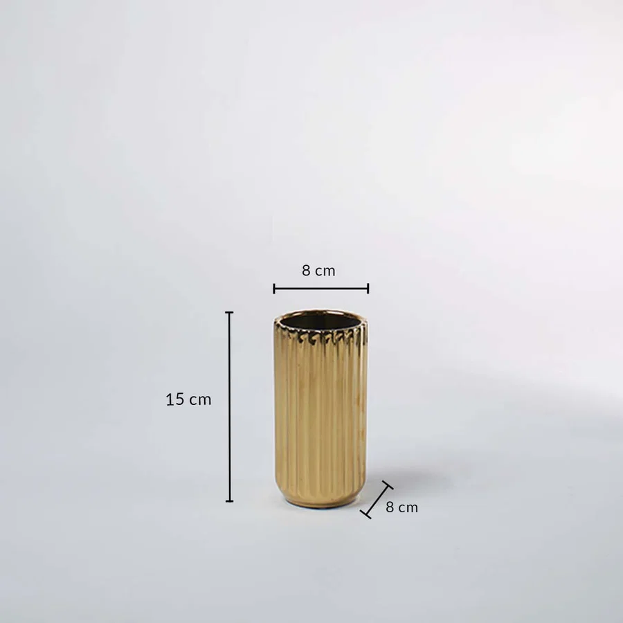 A gold ribbed vase shown with measurements of 15 cm height and 8 cm width clearly presenting its compact decorative size in a clean layout.