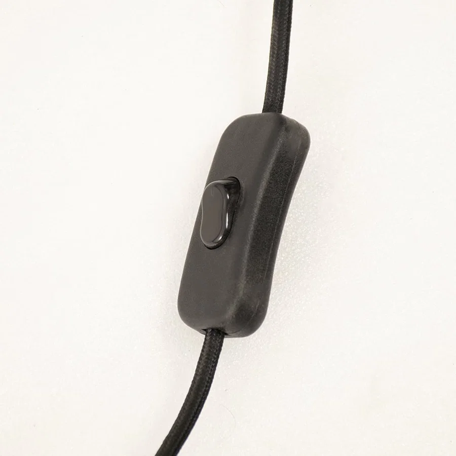 Detailed macro view of a contemporary gold metal wall light fixture highlighting the premium frosted glass linear tube.