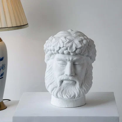 White sculpted head décor piece in a front view ideal for artistic décor styling and modern pedestal display.