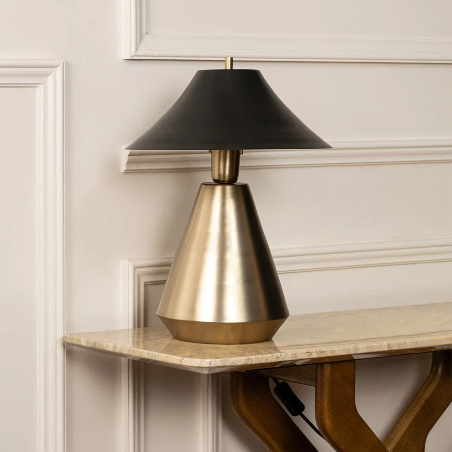 Elegant black and gold metal table lamp for luxury bedroom living room and modern interior decor styling.