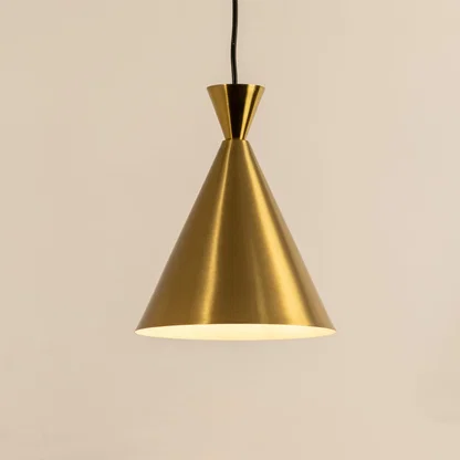 Gold metal cone pendant light illuminated to showcase luxury ceiling lighting with refined modern elegance.
