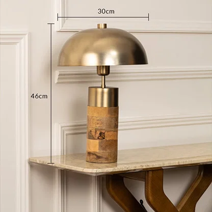 Designer metal and wood table lamp measuring 46 cm tall and 30 cm wide with a gold dome shade ideal for refined and contemporary home lighting.