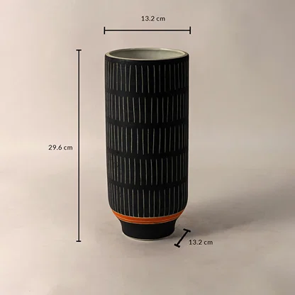 Black ceramic vase with white striped design and orange accent shown with 29.6 cm height and 13.2 cm diameter dimensions.