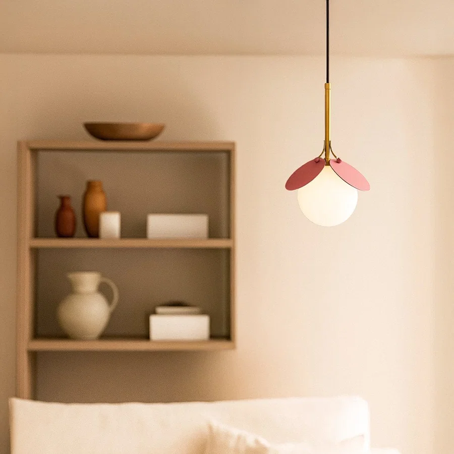 Pink and white glass pendant light adding playful charm to modern bedroom and living room interiors.