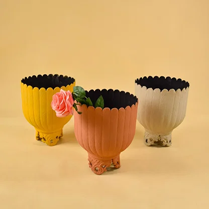 Cream metal scalloped planters displayed together creating a stylish modern decor look ideal for centre tables and consoles.