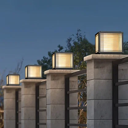 Modern black outdoor gate lights styled on boundary pillars for luxury exterior decor ambiance.