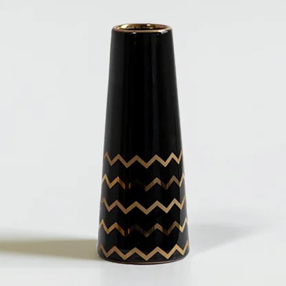 Black ceramic decorative vase with gold zigzag detailing and tapered silhouette for elegant modern home decor styling.