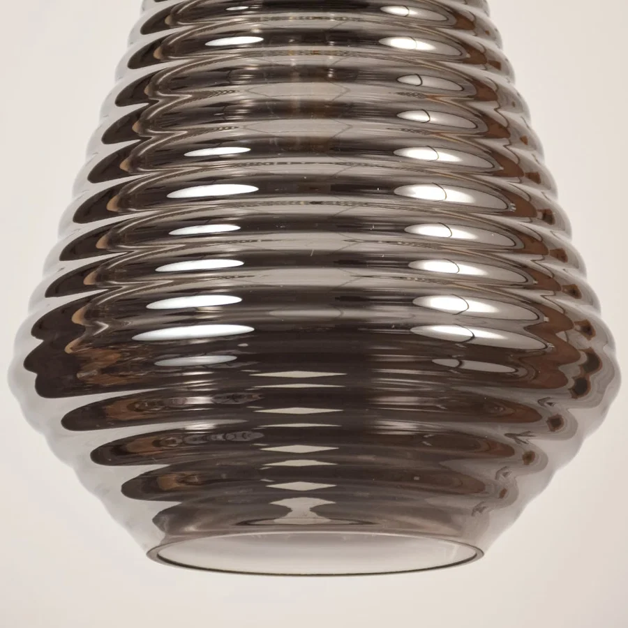 Smoked ribbed glass pendant light showcasing textured glass craftsmanship and contemporary decorative lighting style.