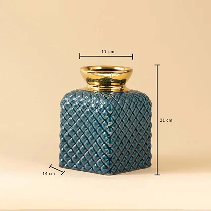 Blue ceramic vase with quilted diamond texture and golden rim shown with 21 cm height  14 cm width  and 11 cm top diameter.