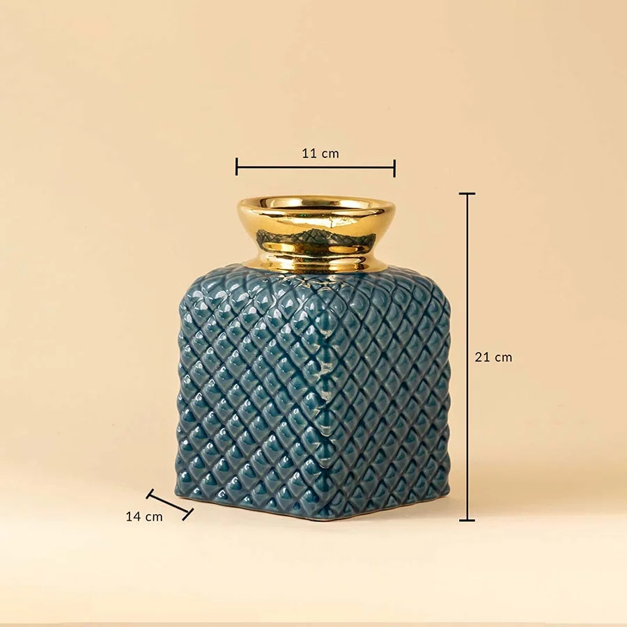 Blue ceramic vase with quilted diamond texture and golden rim shown with 21 cm height  14 cm width  and 11 cm top diameter.