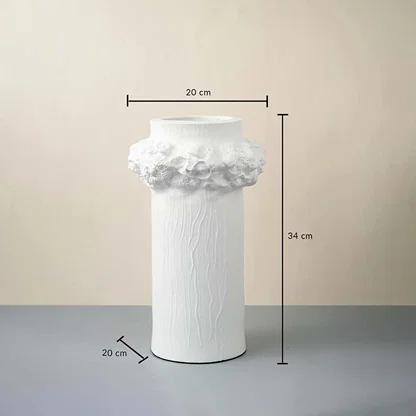 White ceramic vase with floral crown design 34 cm height and 20 cm width ideal for table decor and home styling.