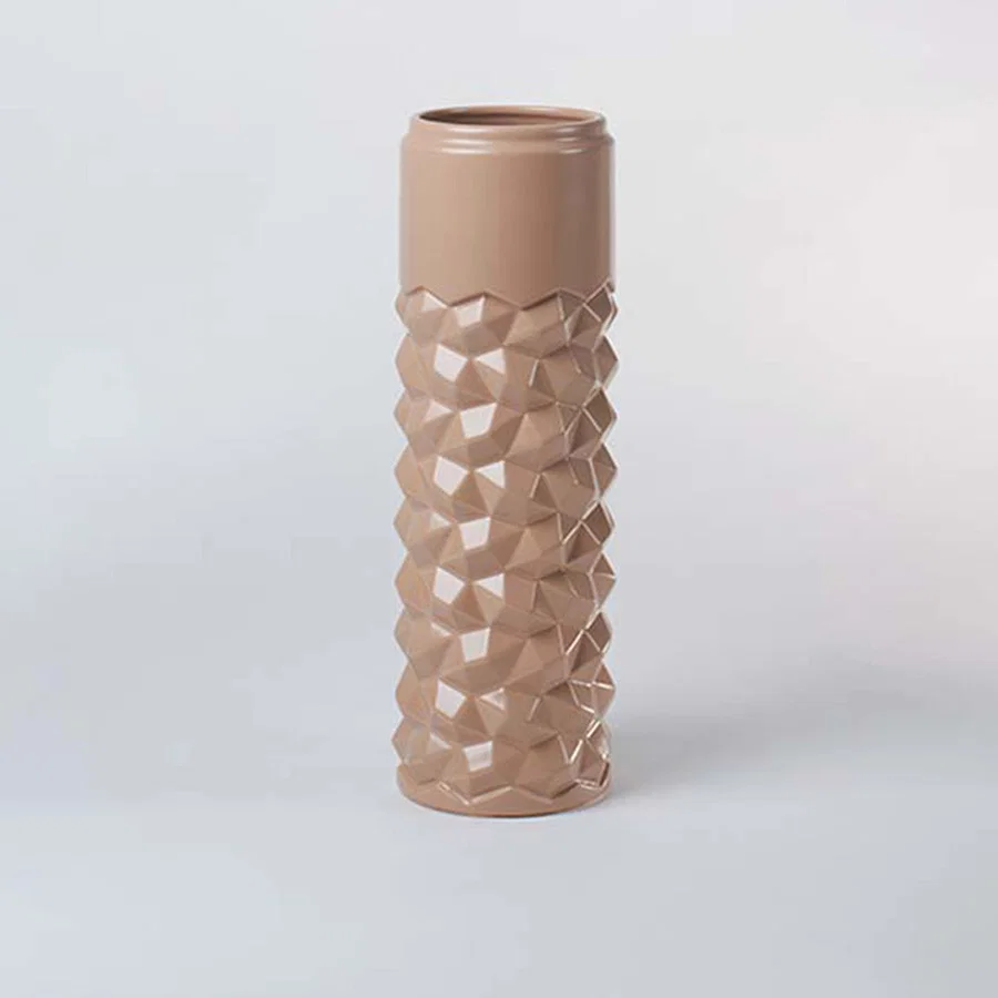 Peach ceramic decorative vase with bubble texture and tall silhouette for contemporary shelf styling and home decor.