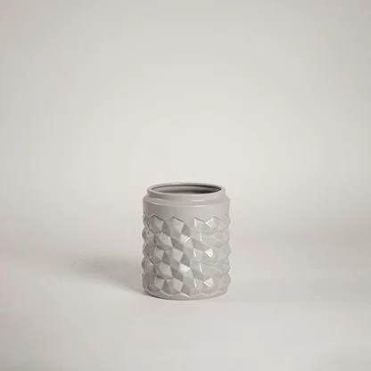 Grey ceramic decorative vase with raised bubble detailing for tabletop styling and modern home decor displays.