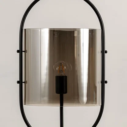 Smoke glass wall light closeup highlighting tinted glass finish and premium modern decorative lighting craftsmanship.