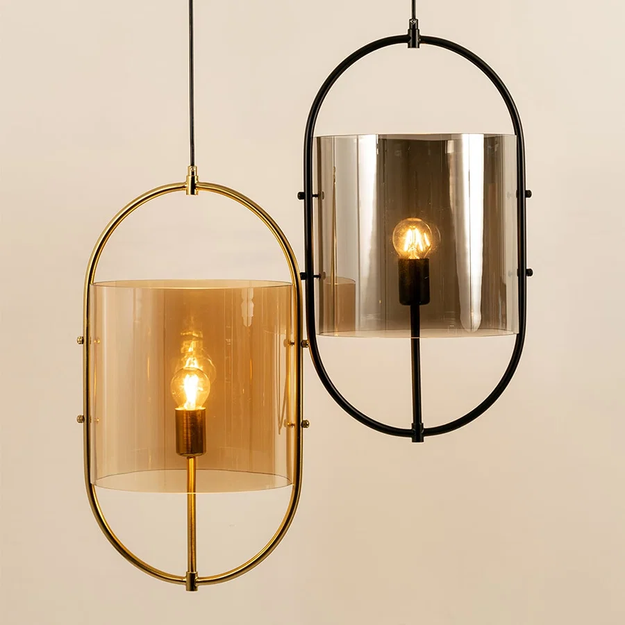 Gold and black metal wall lights illuminated to display contemporary decorative lighting with sophisticated appeal.
