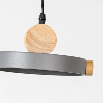 Gray metal pendant light with natural wood detailing showcasing clean lines and modern Scandinavian inspired design.
