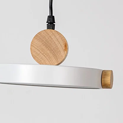 White metal pendant light with natural wood accents showcasing clean lines and modern Scandinavian inspired design.