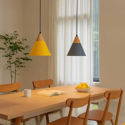 Blue and yellow metal pendant lights above dining table adding Scandinavian charm and warm ambient lighting.