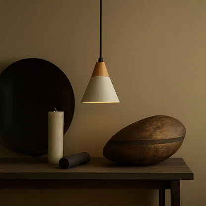 White metal pendant light above console table adding Scandinavian elegance and warm ambient lighting to interiors.