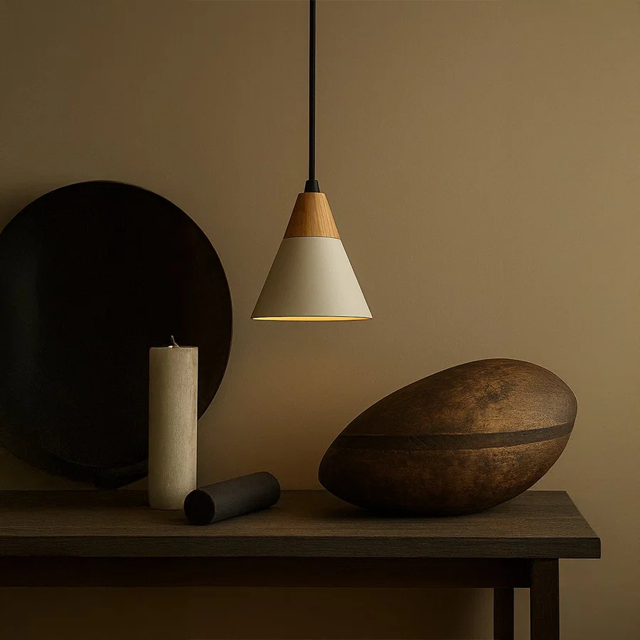 White metal pendant light above console table adding Scandinavian elegance and warm ambient lighting to interiors.