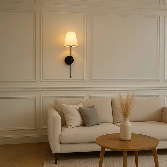 Black metal wall light with white fabric shade styled on a clean wall for modern home lighting decor.