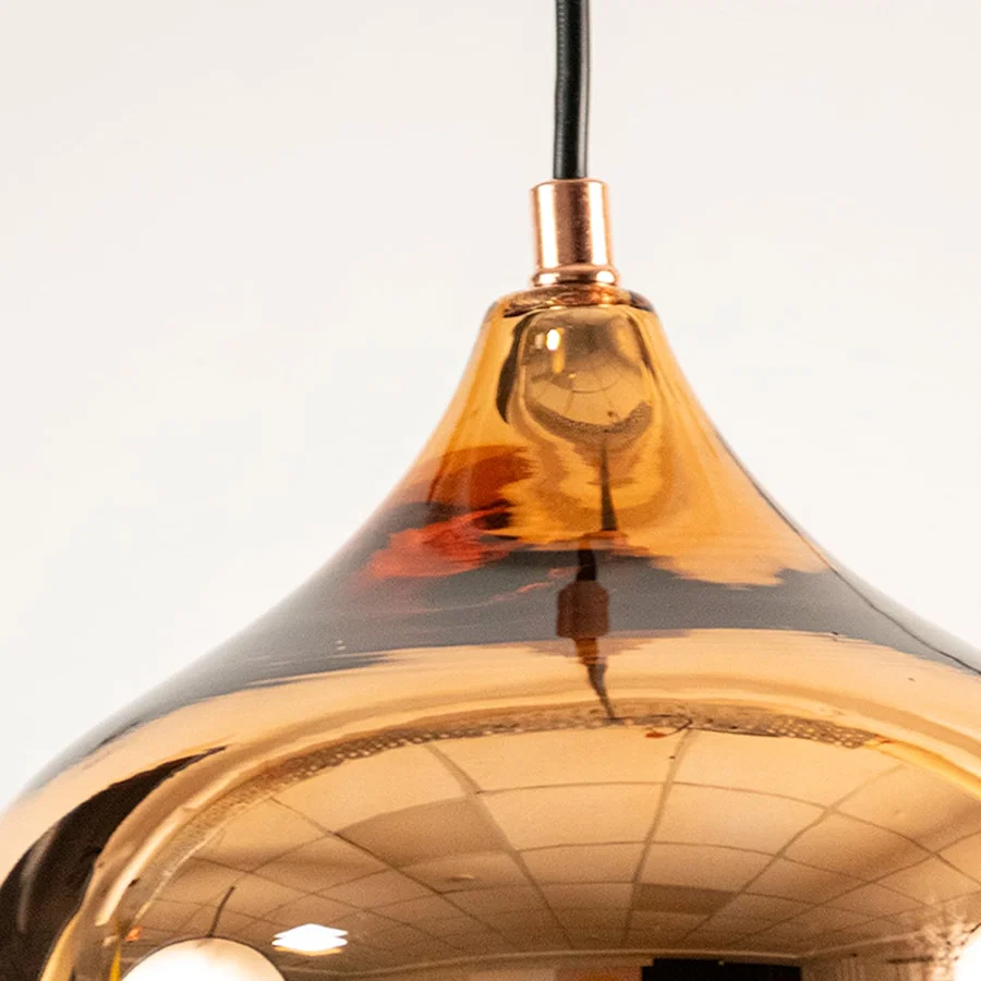 Copper glass pendant light closeup highlighting mirrored surface detailing and premium decorative craftsmanship quality.