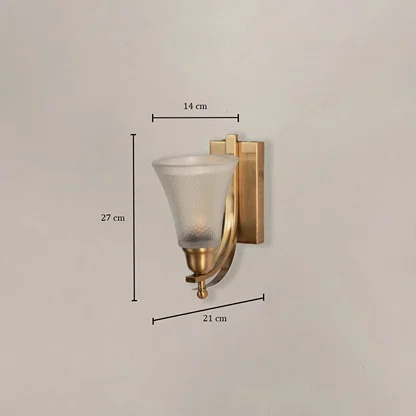 Contemporary brass wall sconce with frosted glass shade measuring 27cm height 14cm shade width and 21cm projection from wall.