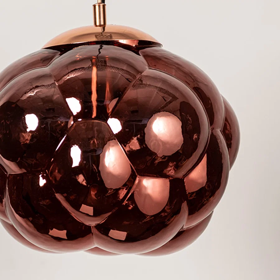 Copper glass pendant light featuring glossy sculpted glass texture and contemporary design for luxury interior decor.
