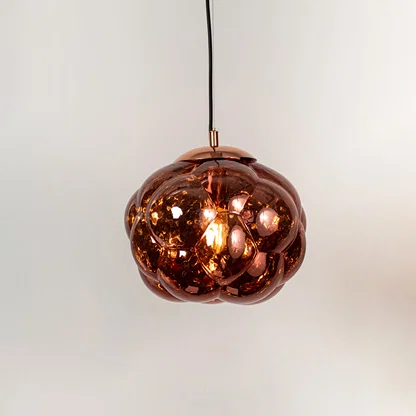 Copper glass pendant light with sculpted bubble design and reflective finish for statement ceiling lighting decor.