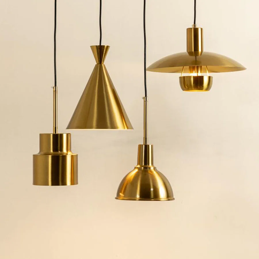 Modern gold metal pendant lights for elegant kitchen island and dining room decor inspiration styling.