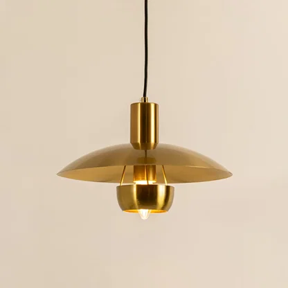 Gold metal pendant light with dome shade illuminated to showcase modern ceiling lighting and premium decorative appeal.