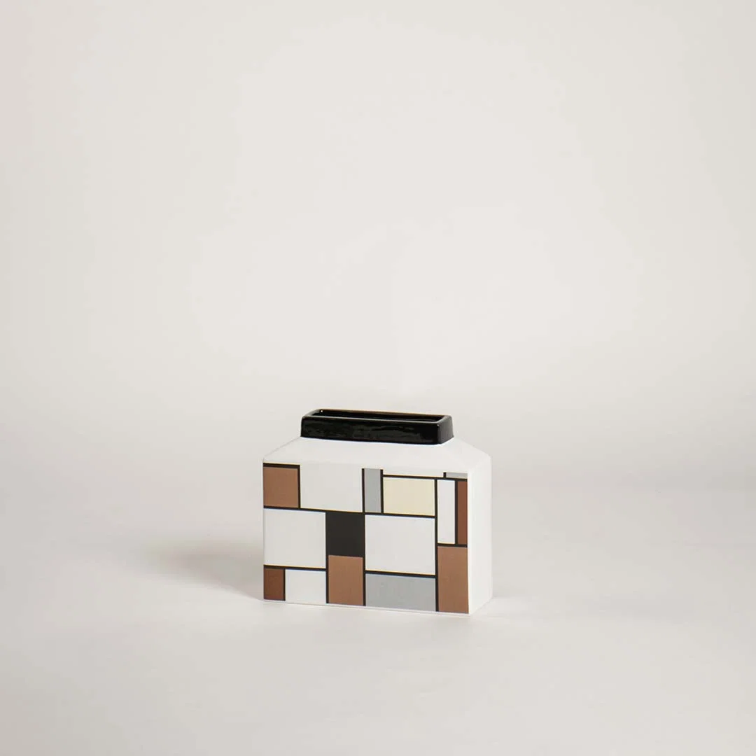 Modern wide rectangular ceramic vase with an abstract geometric block grid pattern on white background for art decor.