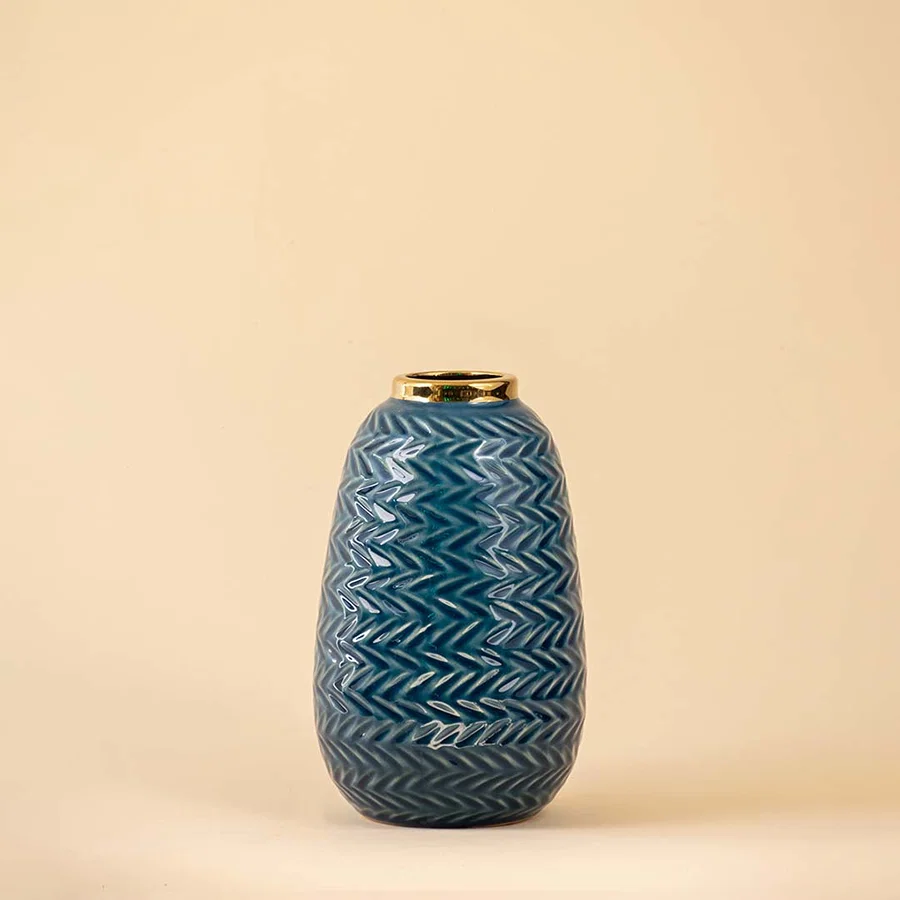 Blue ceramic decorative vase with embossed texture and gold accent for contemporary tabletop styling and decor.