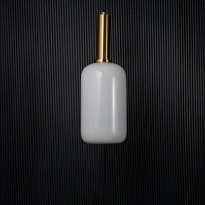Modern white glass pendant light turned off with golden holder displayed elegantly on black background decor.