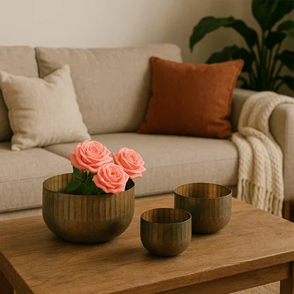 Bronze ribbed bowl planter styled in a warm modern space adding a soft rustic accent to shelves tables and decor corners.